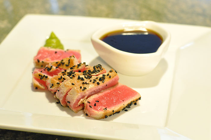 There are like six stray sesame seeds happening here, and excuse me -- who's idea was it to swirl the wasabi paste into a little pile of poo?